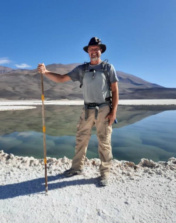 Geologist Brian Hynek found the lagoon filled with green mounds of stromatolites. Credit: Brian Hynek