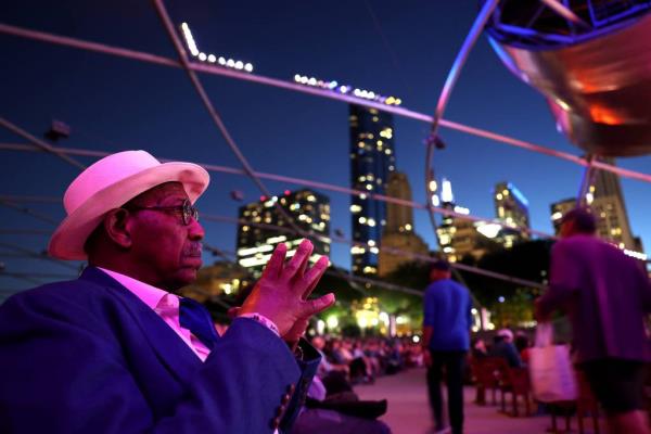 Ahmed Benbayla of Springfield relaxes in Millennium Park’s Pritzker Pavilion while attending the Chicago Jazz Festival on Aug. 31, 2023.  