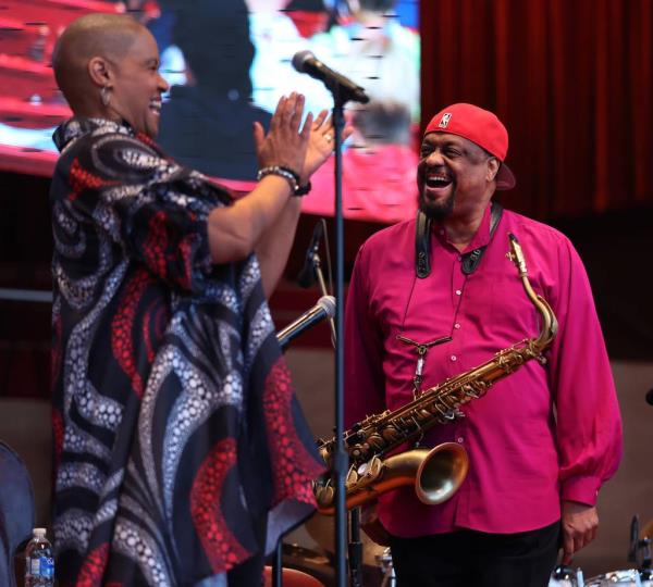 Vocalist Margaret Murphy-Webb, left, and tenor saxopho<em></em>nist Chico Freeman laugh on stage during the Chicago Jazz Festival in Millennium Park.